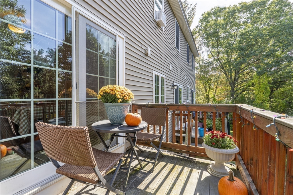 41 Boston Road, Unit 464 Billerica, MA 01862 - Photo 13 of 15 a view of a chair and table in the balcony