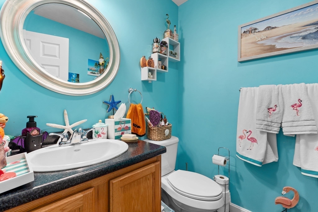 41 Boston Road, Unit 464 Billerica, MA 01862 - Photo 9 of 15 a bathroom with a toilet a sink and a mirror