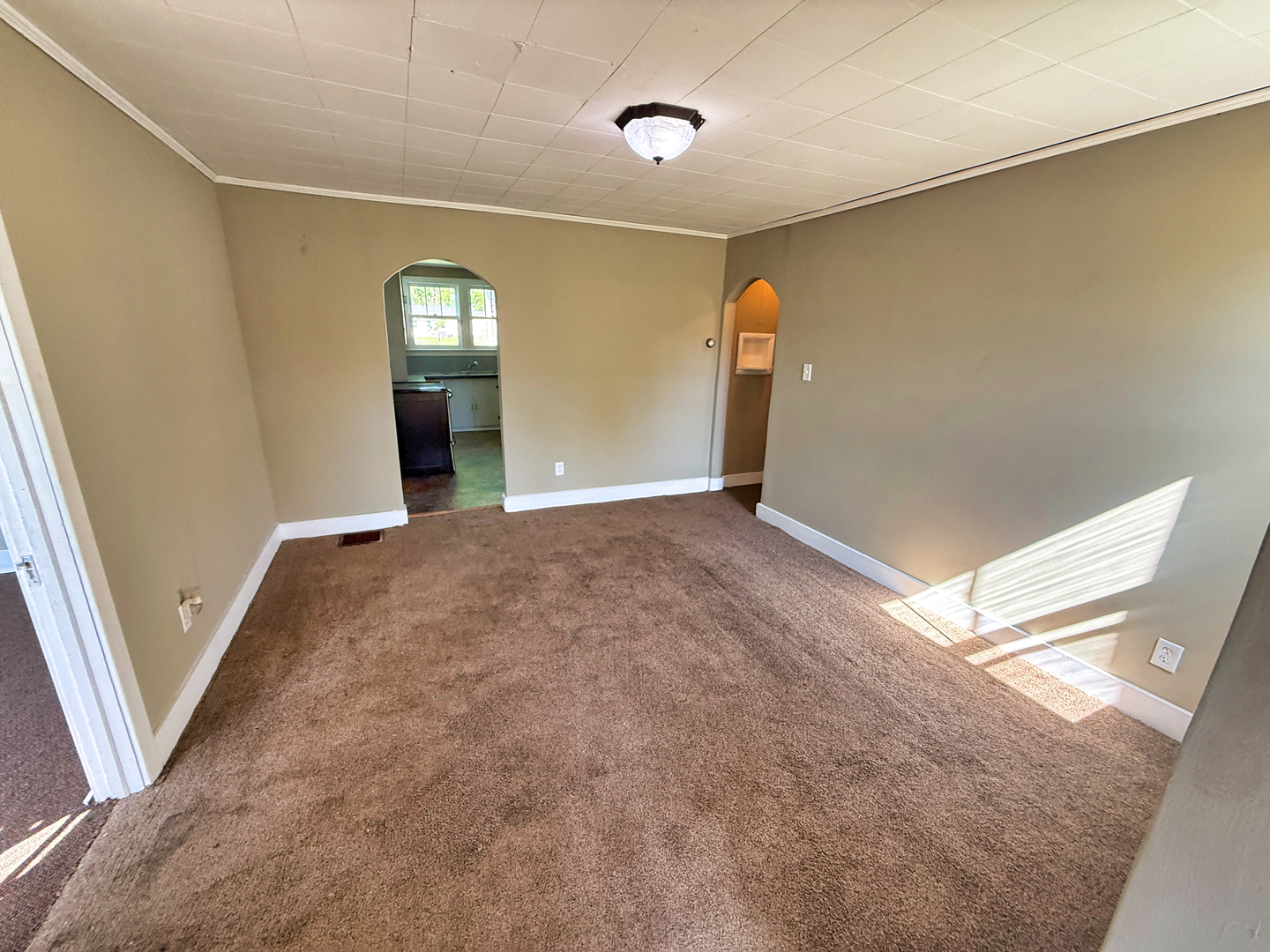 426 South Locust Street Flora, IL 62839 - Photo 12 of 58 an empty room with windows and entrance