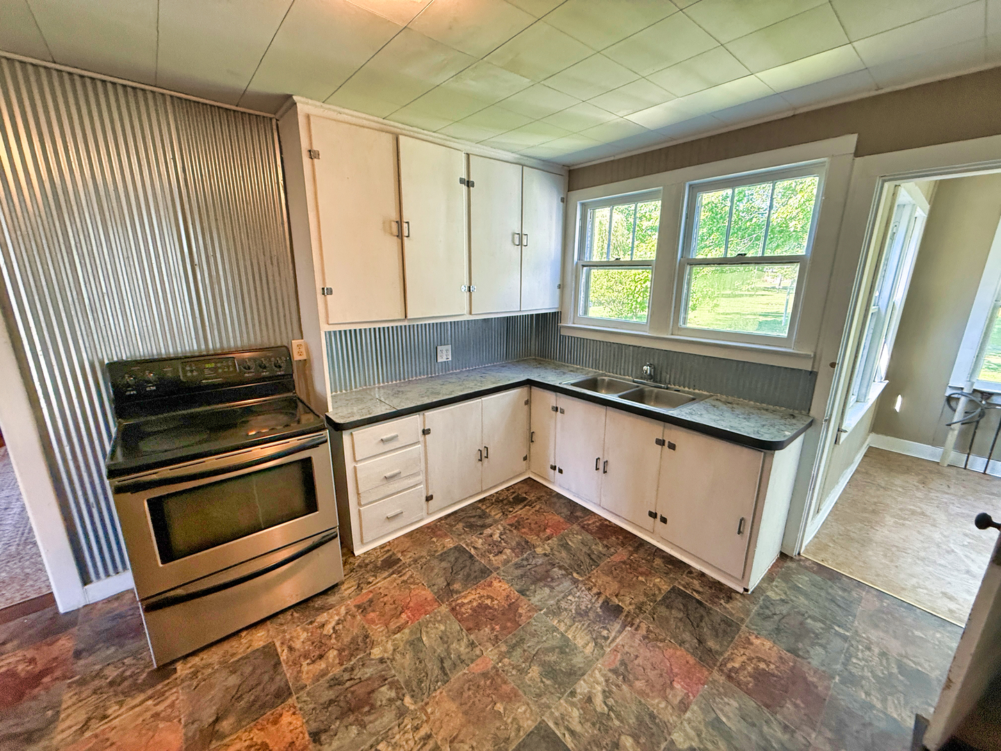 426 South Locust Street Flora, IL 62839 - Photo 2 of 58 a kitchen with a refrigerator stove and cabinets