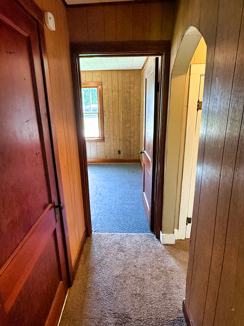 426 South Locust Street Flora, IL 62839 - Photo 30 of 58 a view of a hallway with wooden floor