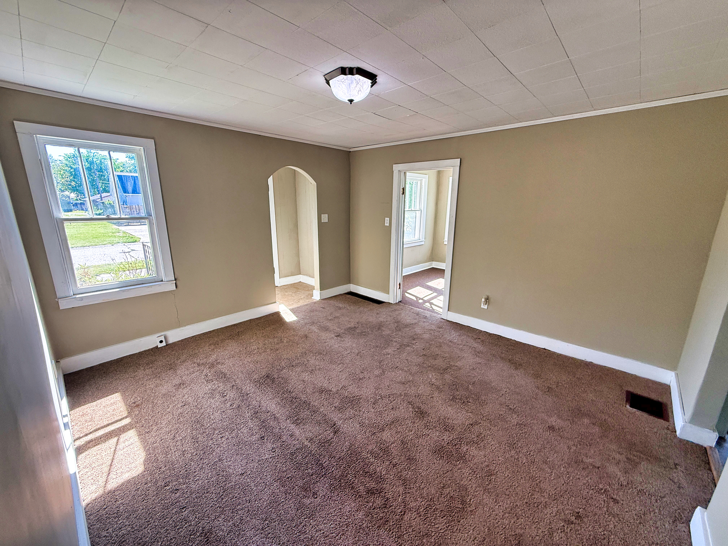 426 South Locust Street Flora, IL 62839 - Photo 5 of 58 a view of an empty room with a window