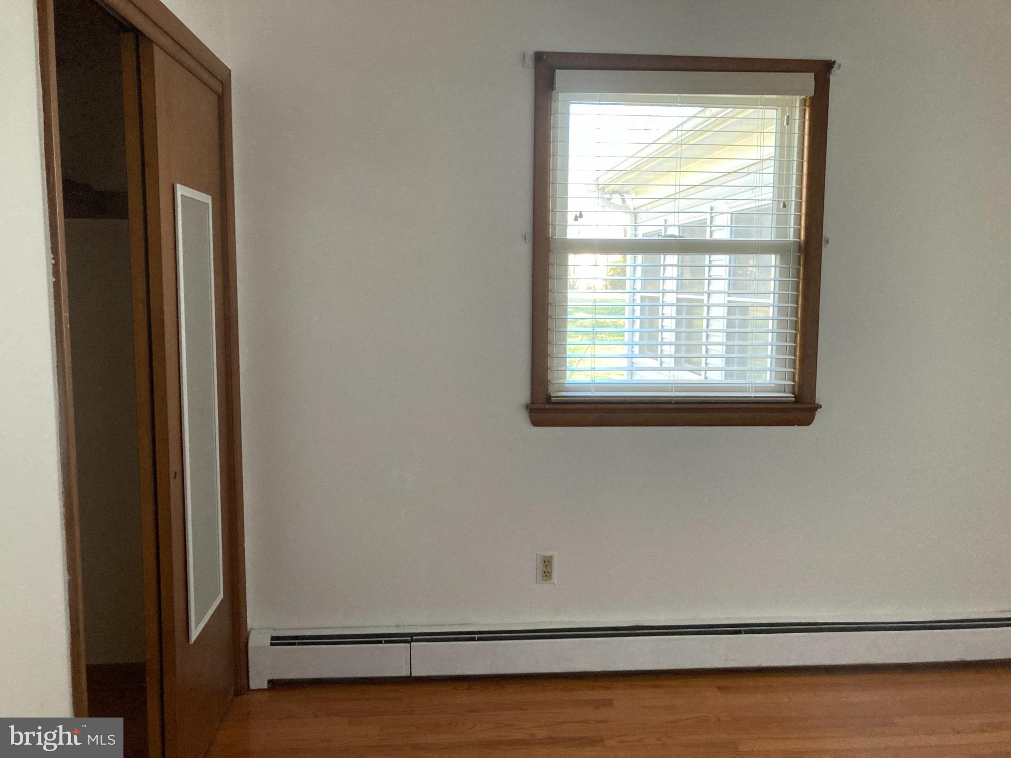 14104 Schaeffer Road Germantown, MD 20874 - Photo 18 of 42 a view of a room with wooden floor and windows