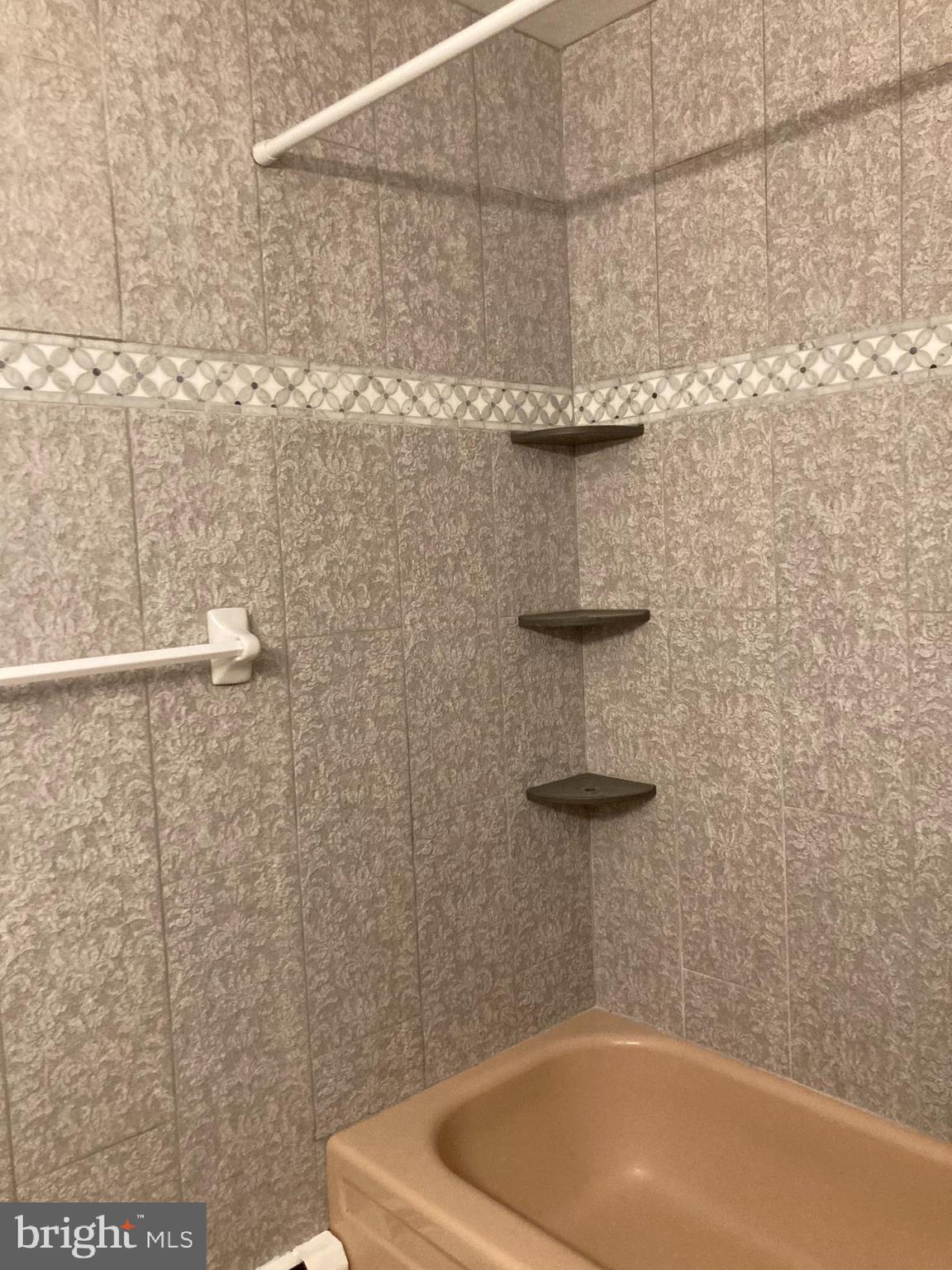 14104 Schaeffer Road Germantown, MD 20874 - Photo 21 of 42 a bathroom with a white bath tub and a shower