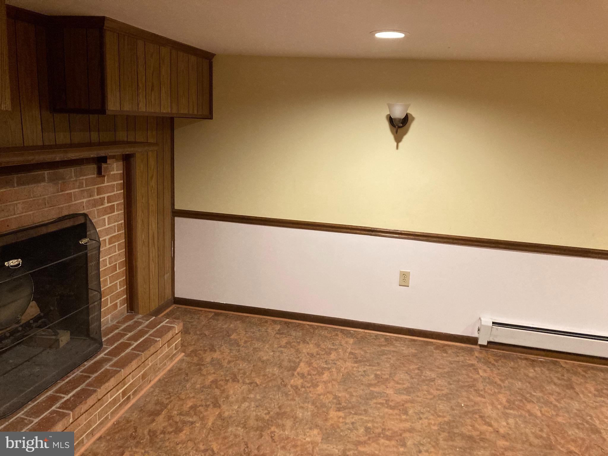 14104 Schaeffer Road Germantown, MD 20874 - Photo 22 of 42 a view of an empty room with a fireplace
