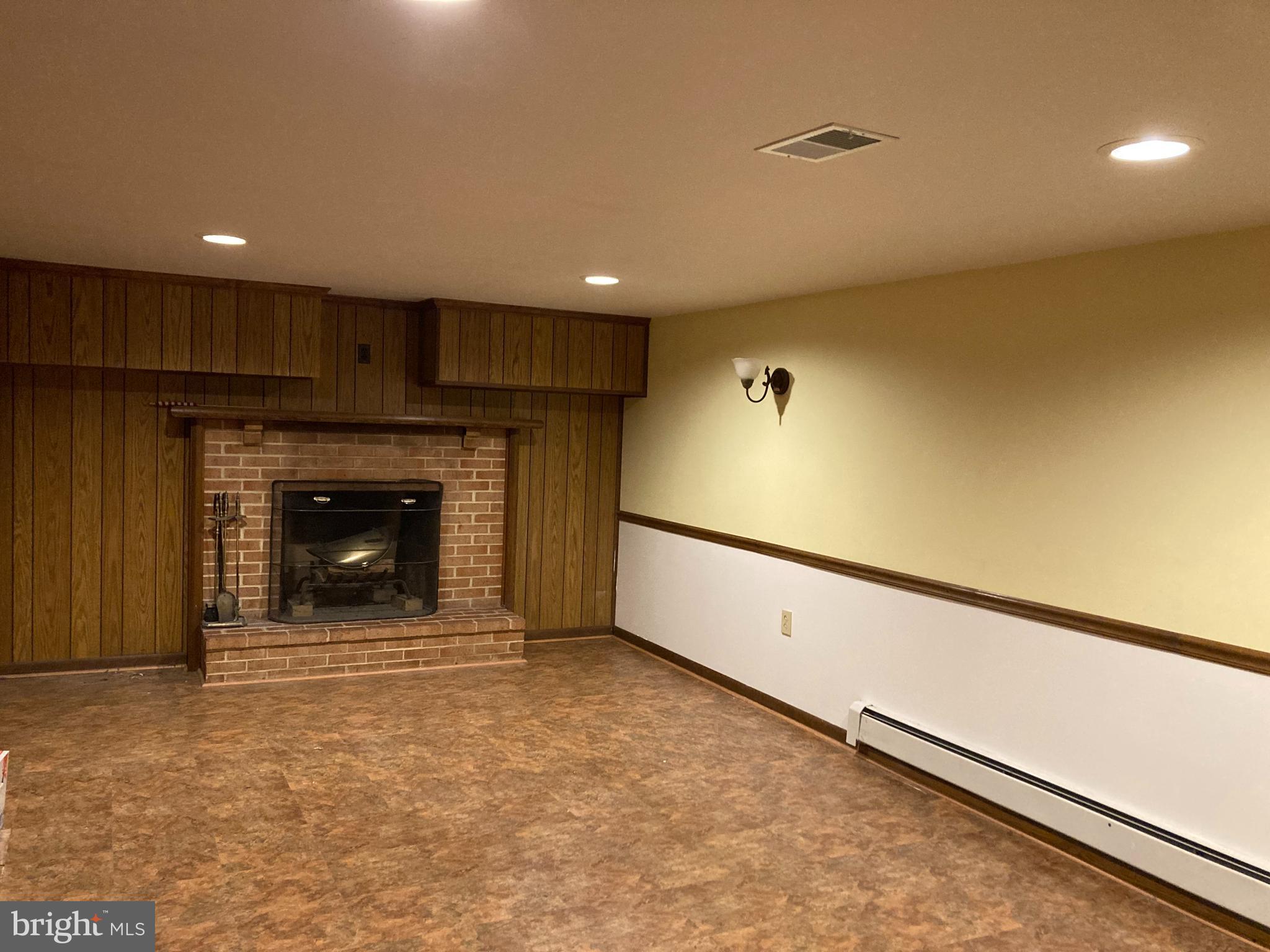 14104 Schaeffer Road Germantown, MD 20874 - Photo 25 of 42 a view of an empty room with a fireplace