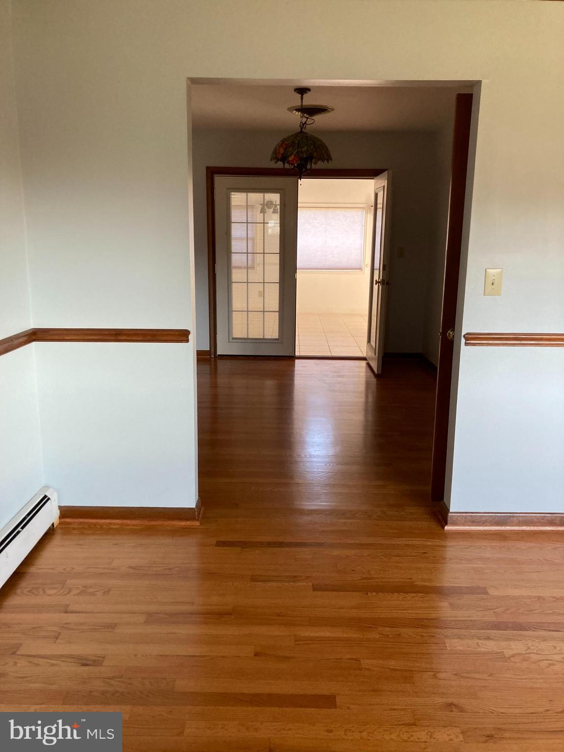 14104 Schaeffer Road Germantown, MD 20874 - Photo 6 of 42 a view of empty room with wooden floor and fan