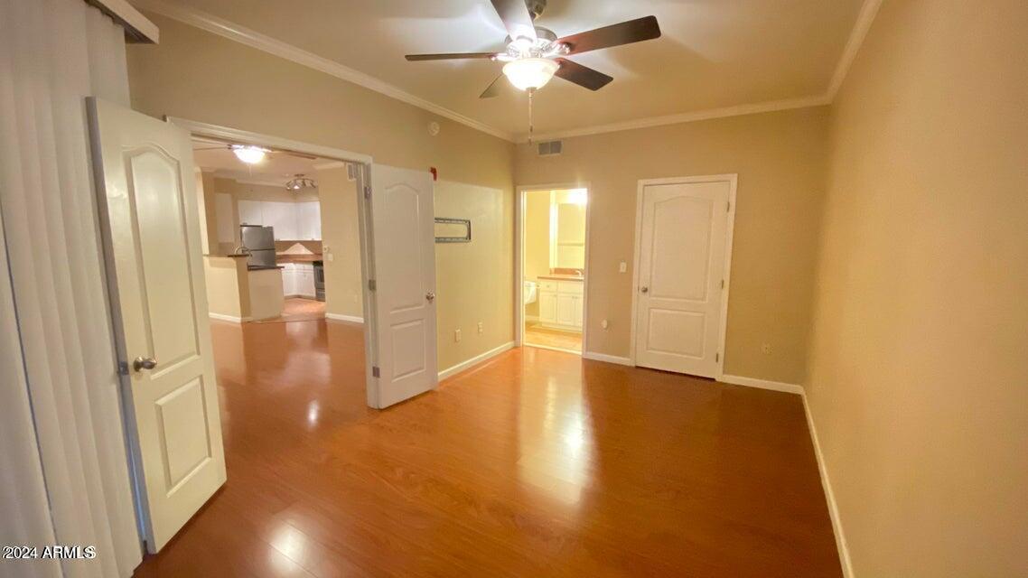 1701 East Colter Street, Unit 165 Phoenix, AZ 85016 - Photo 13 of 33 a view of a hallway with wooden floor