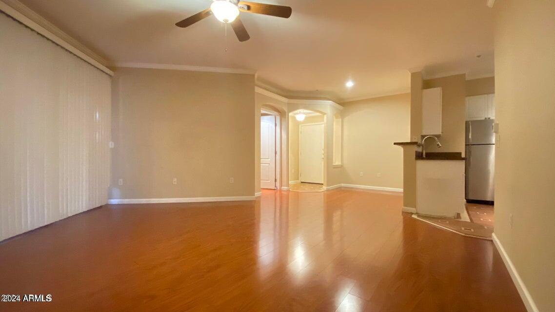1701 East Colter Street, Unit 165 Phoenix, AZ 85016 - Photo 2 of 33 a view of a livingroom with wooden floor