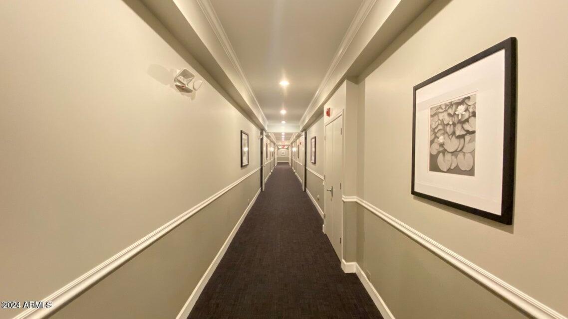 1701 East Colter Street, Unit 165 Phoenix, AZ 85016 - Photo 21 of 33 a view of a hallway with wooden floor and staircase