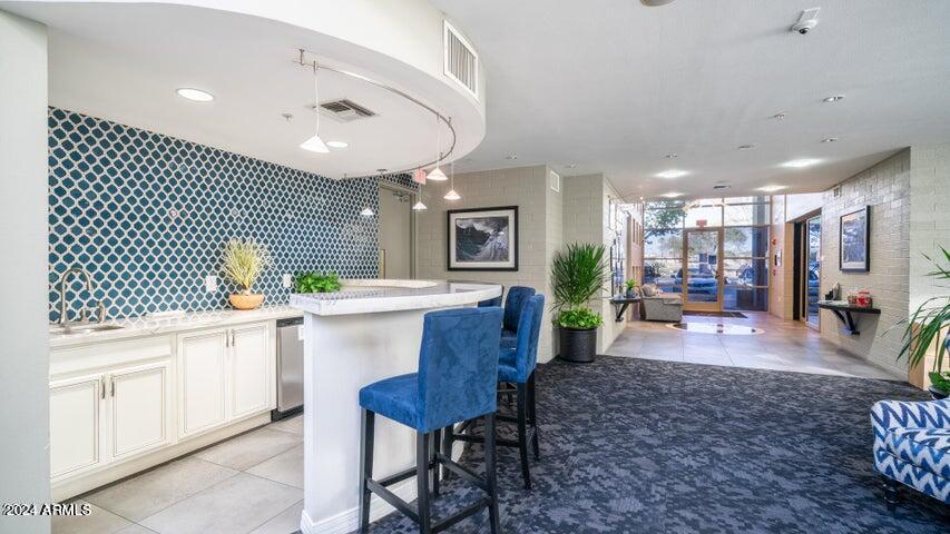 1701 East Colter Street, Unit 165 Phoenix, AZ 85016 - Photo 30 of 33 a large kitchen with a table and chairs
