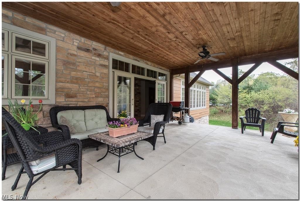 12430 Falcon Ridge Road Chesterland, OH 44026 - Photo 23 of 28 Look how pretty the stone detail and the pine
ceiling showcase this cozy patio!