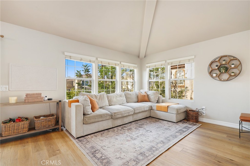 12 Montana Del Lago Drive, Unit 168 Rancho Santa Margarita, CA 92688 - Photo 5 of 23 a living room with furniture and a large window