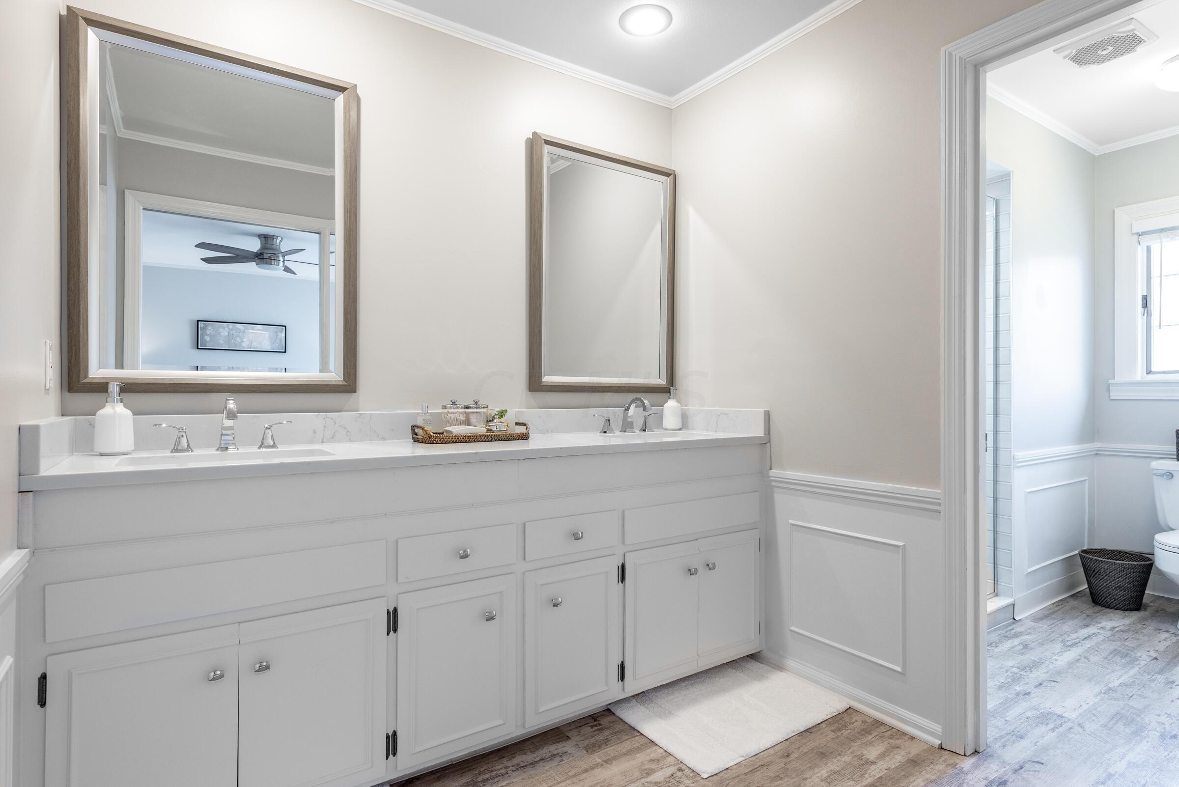 2666 Chartwell Road Columbus, OH 43220 - Photo 26 of 42 Recently renovated Owner's bath offers double sink granite top vanity.