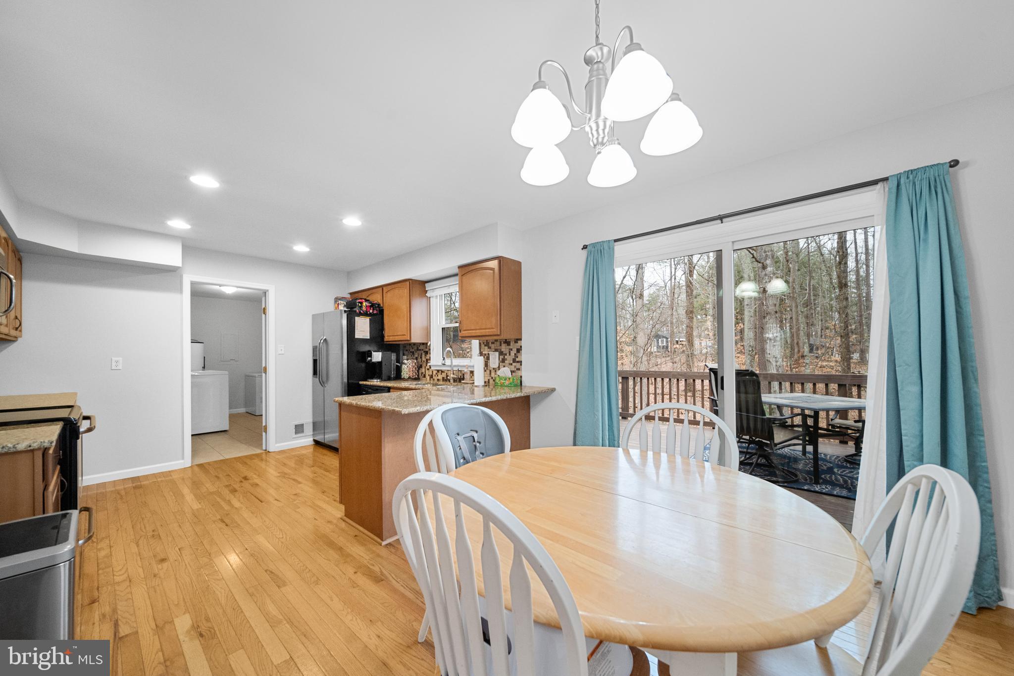 5344 Courtneys Corner Road Sumerduck, VA 22742 - Photo 13 of 56 a large kitchen with a table and chairs