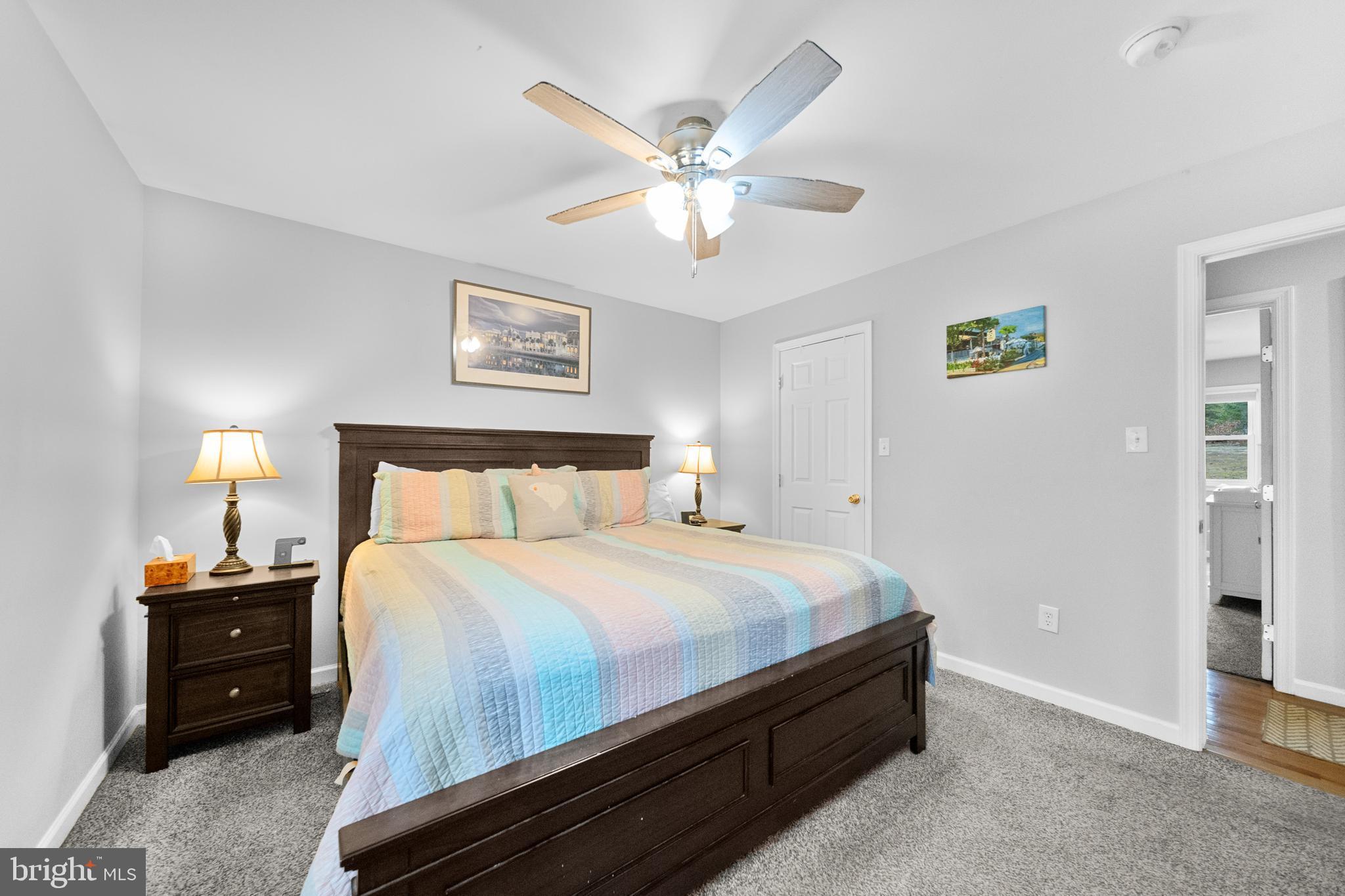 5344 Courtneys Corner Road Sumerduck, VA 22742 - Photo 17 of 56 a bedroom with a bed and a chandelier
