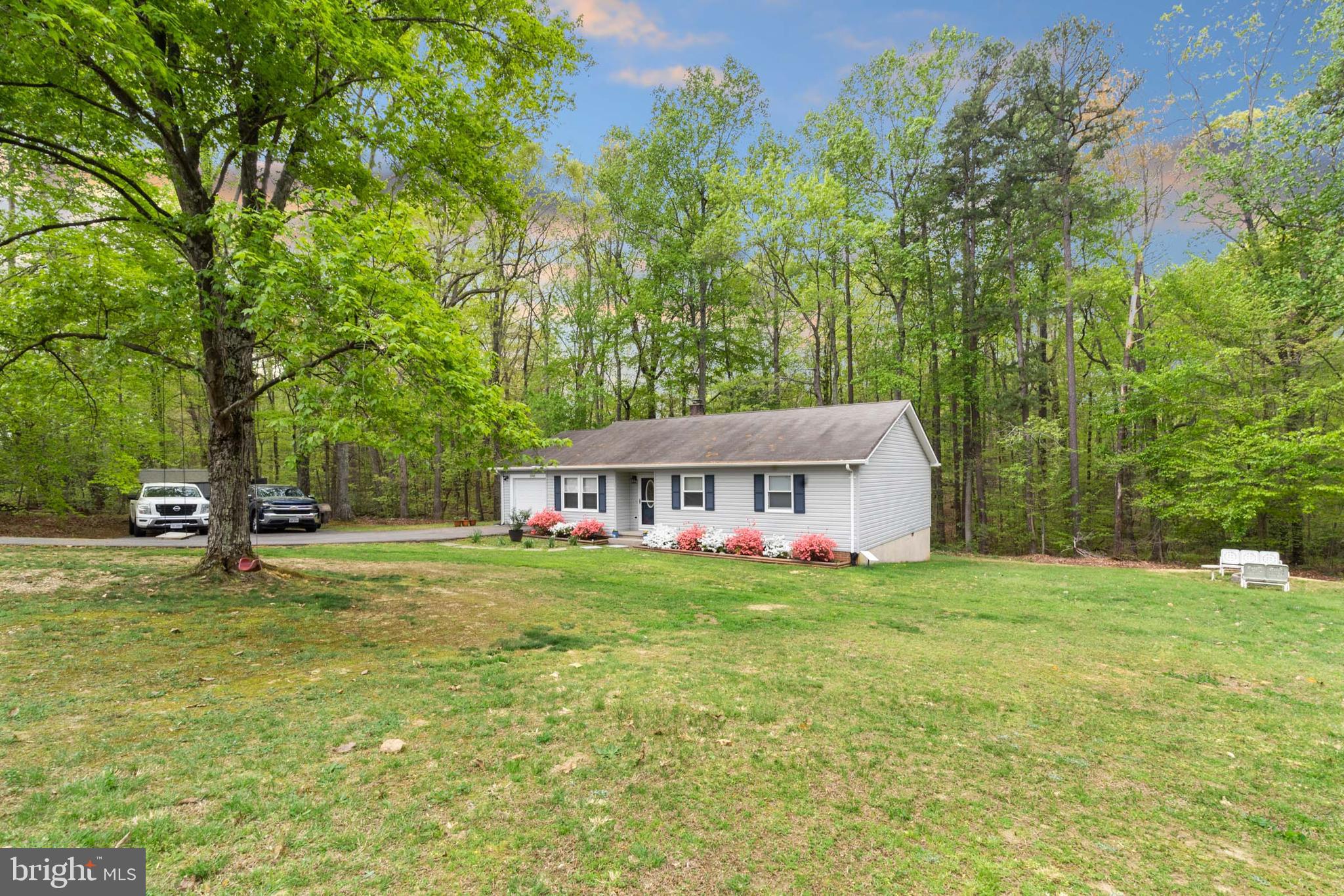 5344 Courtneys Corner Road Sumerduck, VA 22742 - Photo 4 of 56 a view of a house with a big yard and large trees