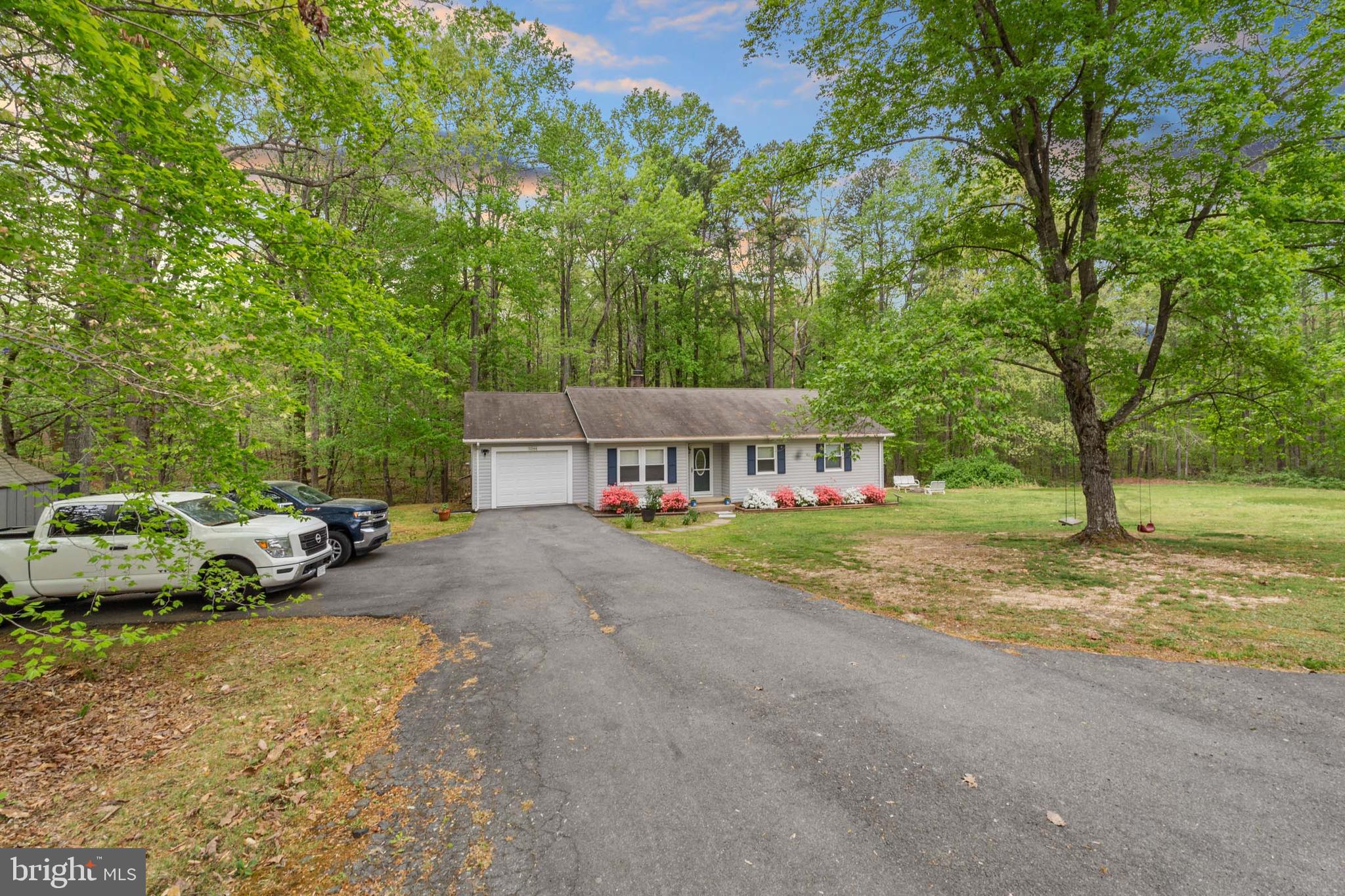 5344 Courtneys Corner Road Sumerduck, VA 22742 - Photo 51 of 56 a view of a house with large trees and a small yard