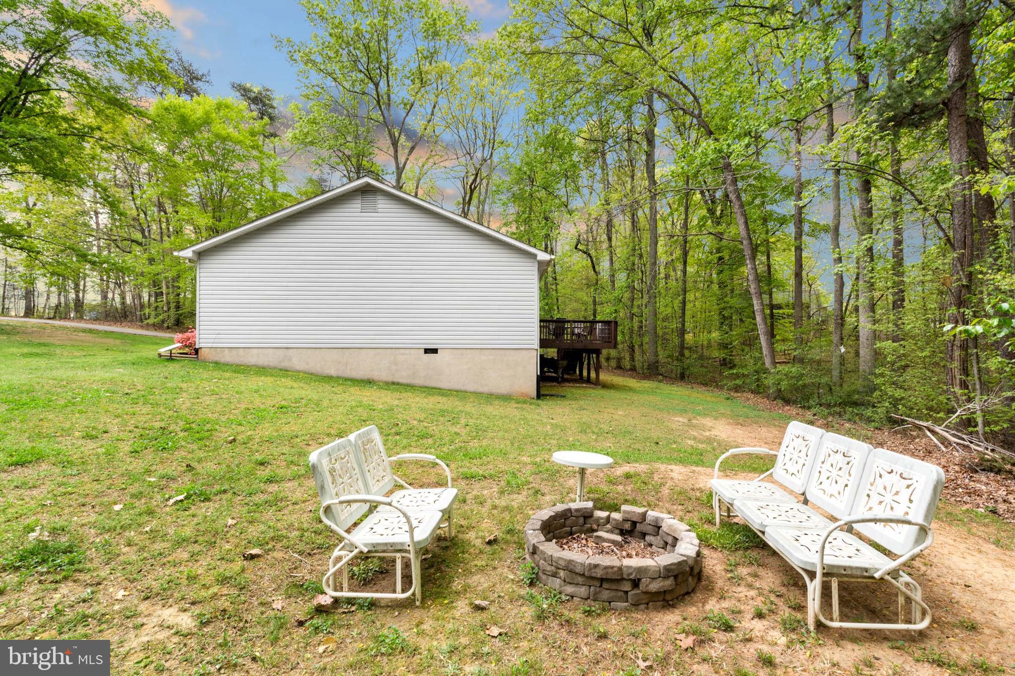 5344 Courtneys Corner Road Sumerduck, VA 22742 - Photo 54 of 56 a backyard of a house with yard and outdoor seating
