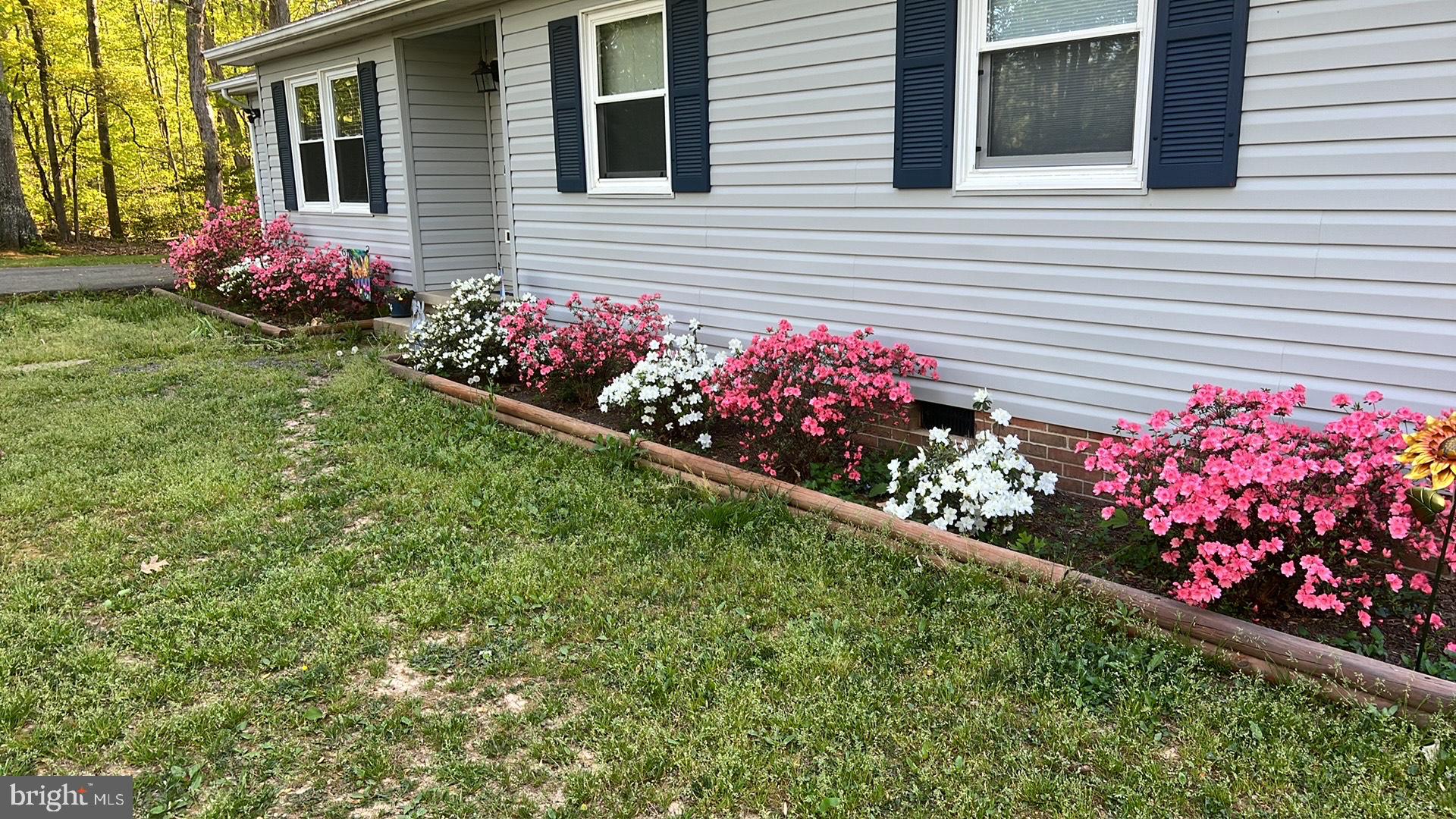5344 Courtneys Corner Road Sumerduck, VA 22742 - Photo 6 of 56 a view of a flowers in front of the house