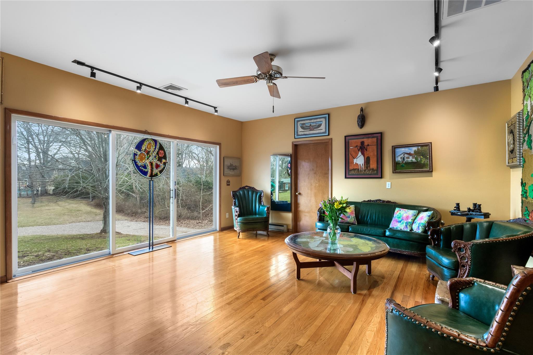 15 South Menantic Road Shelter Island, NY 11964 - Photo 11 of 44 a living room with furniture and a floor to ceiling window