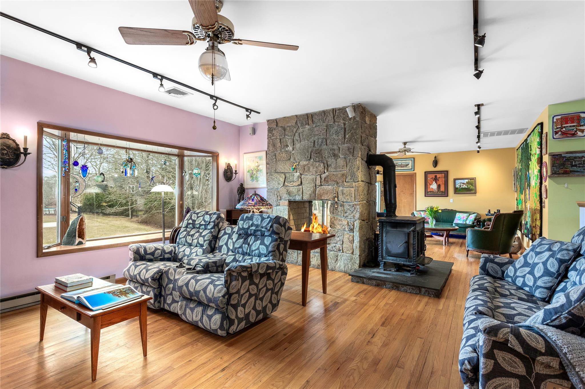 15 South Menantic Road Shelter Island, NY 11964 - Photo 13 of 44 a living room with furniture and a large window