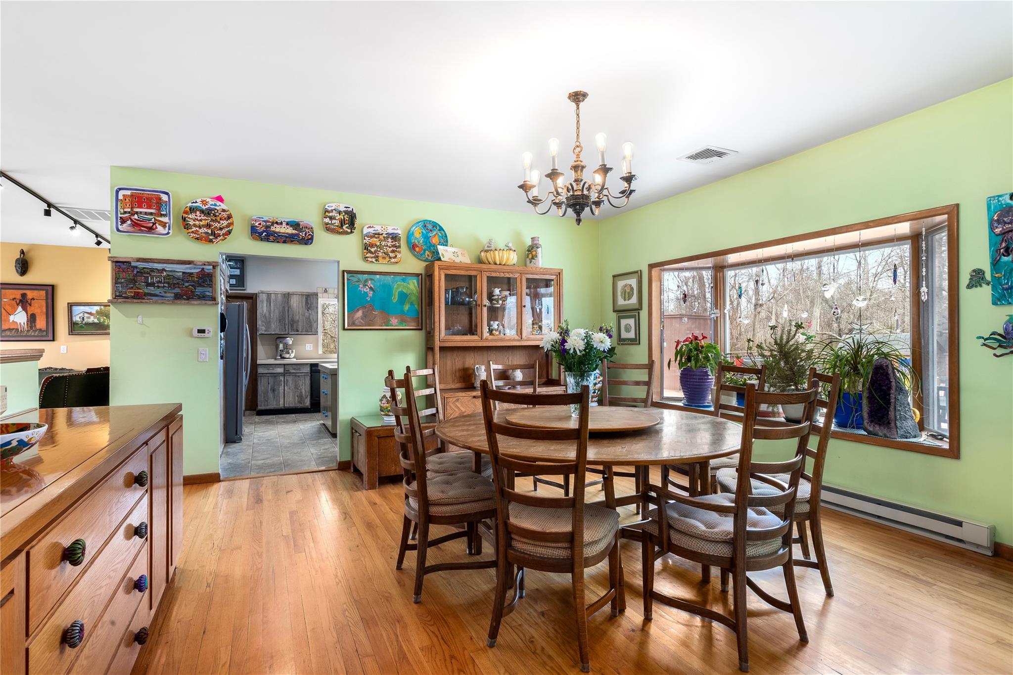 15 South Menantic Road Shelter Island, NY 11964 - Photo 14 of 44 a view of a dining room with furniture window and wooden floor