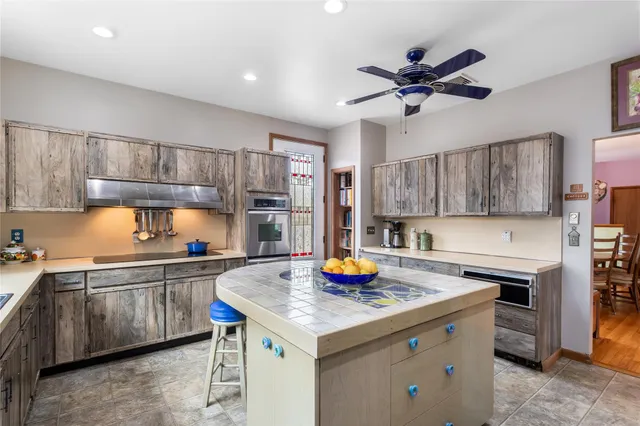 a bed room with a bed tv and a window