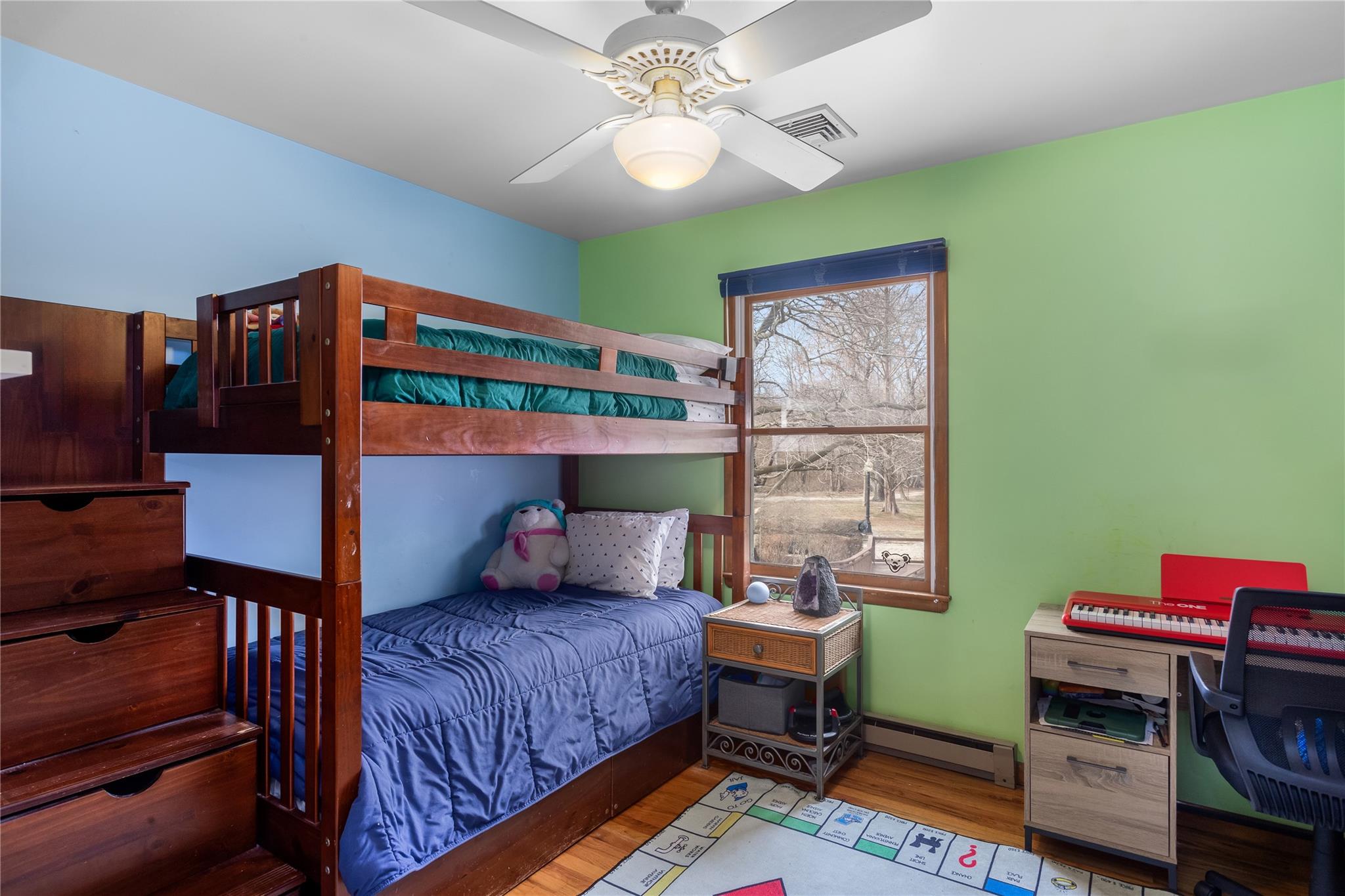 15 South Menantic Road Shelter Island, NY 11964 - Photo 18 of 44 a bedroom with a bed and a bookshelf