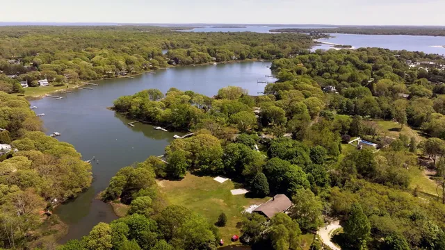 a front view of a building with a yard