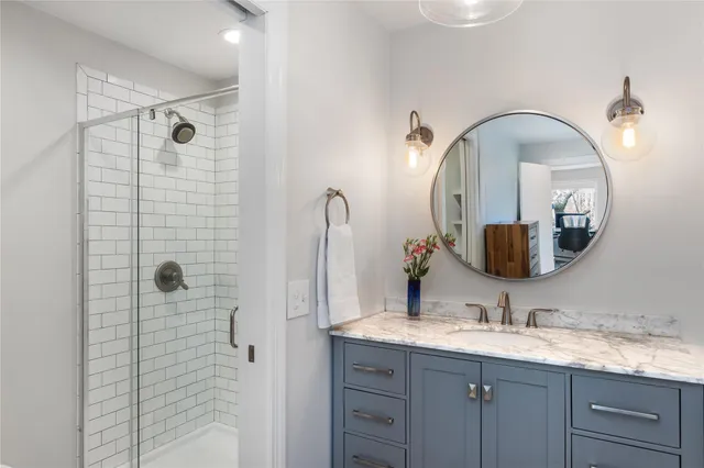 a kitchen with a refrigerator and potted plant