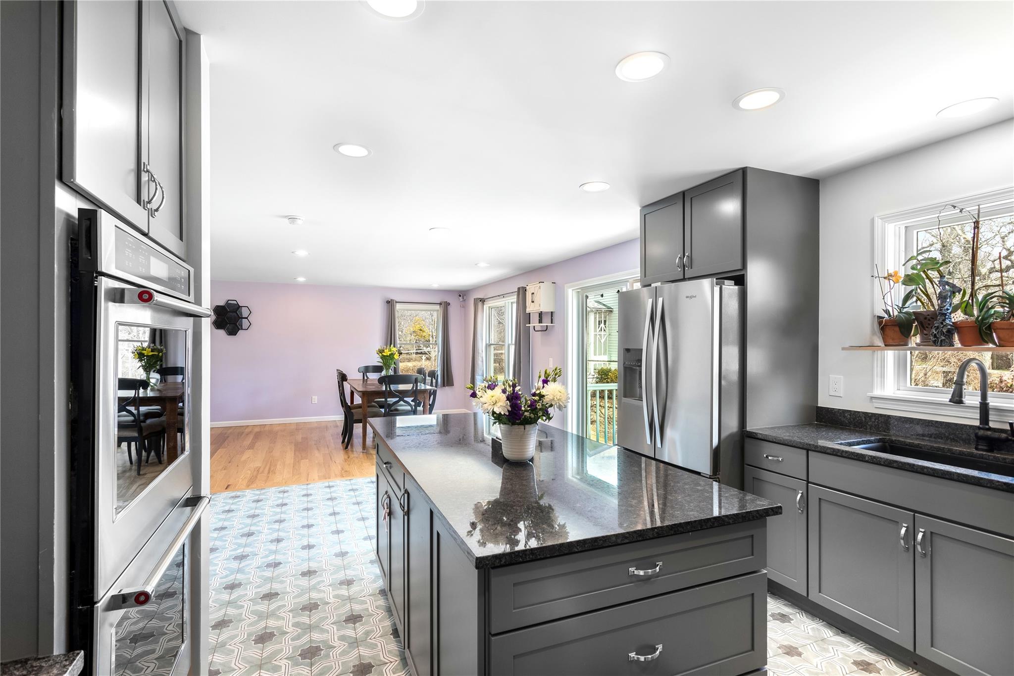 15 South Menantic Road Shelter Island, NY 11964 - Photo 32 of 44 a kitchen with stainless steel appliances granite countertop a refrigerator and a sink