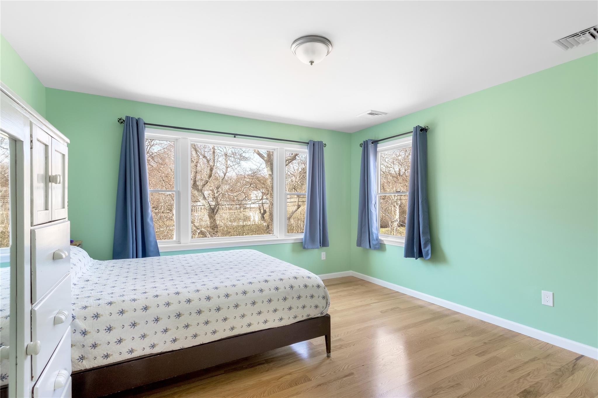 15 South Menantic Road Shelter Island, NY 11964 - Photo 35 of 44 a bedroom with a bed and a window