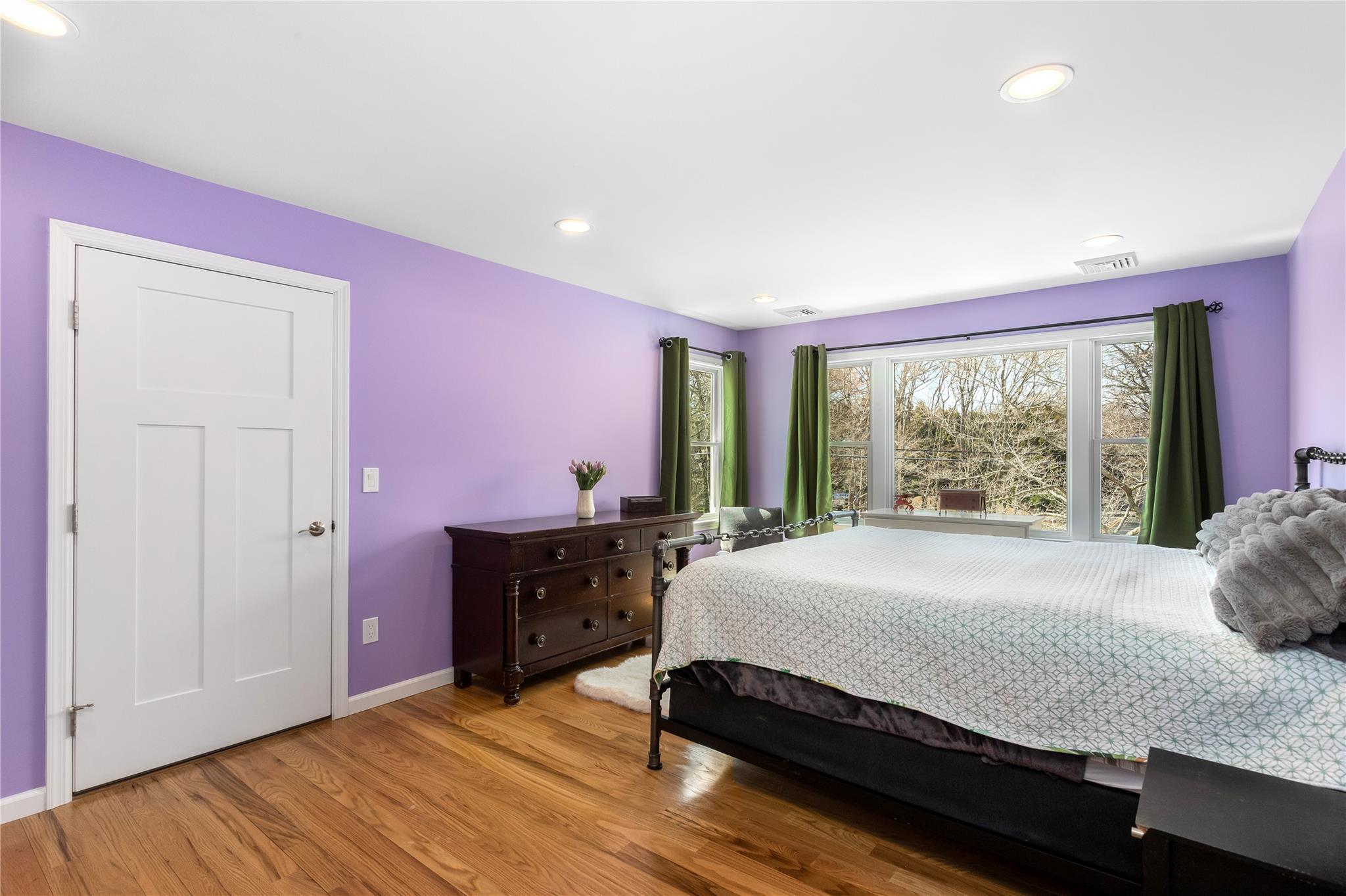 15 South Menantic Road Shelter Island, NY 11964 - Photo 37 of 44 a bedroom with a bed and large windows