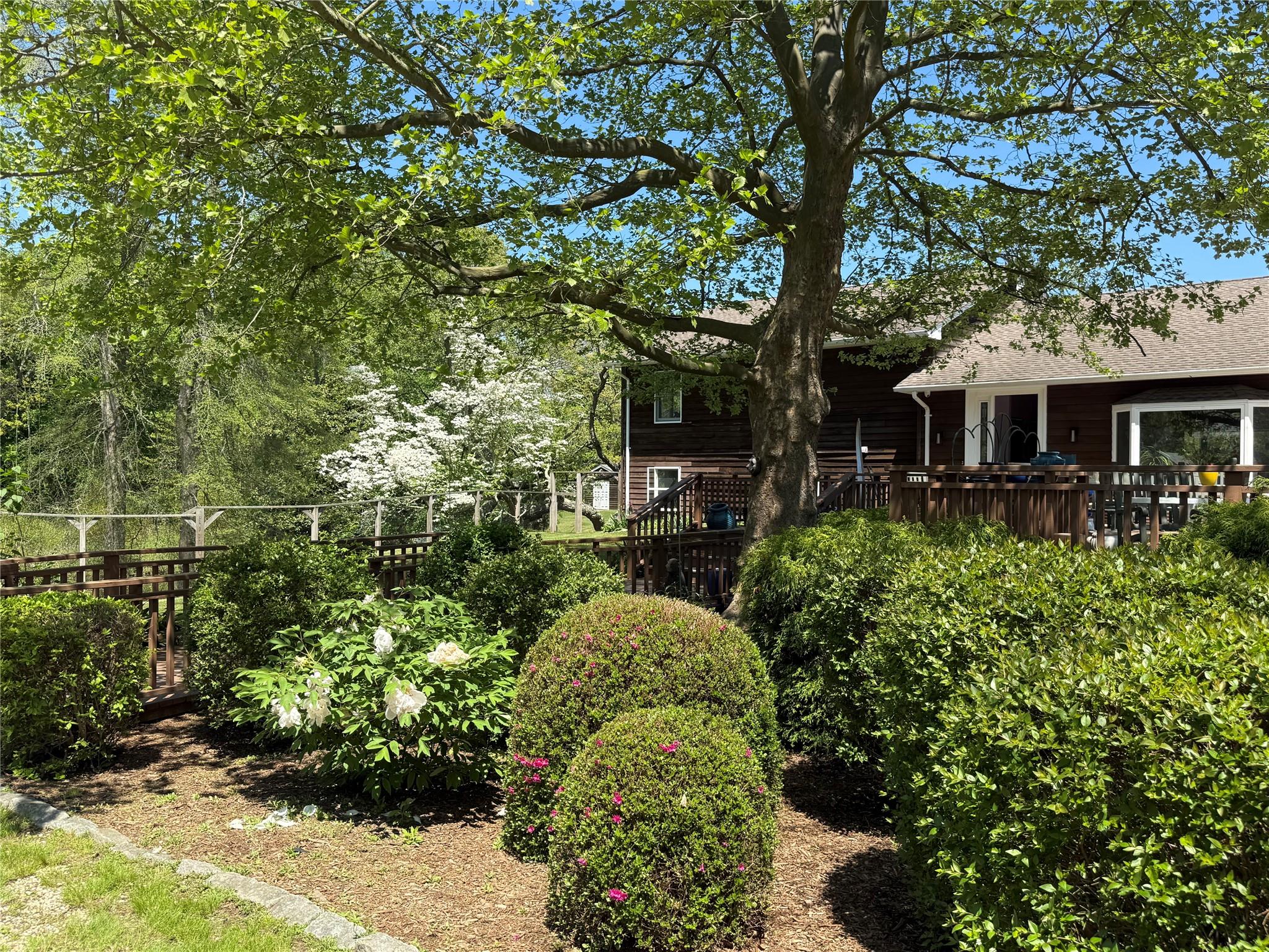 15 South Menantic Road Shelter Island, NY 11964 - Photo 41 of 44 a front view of a house with a yard