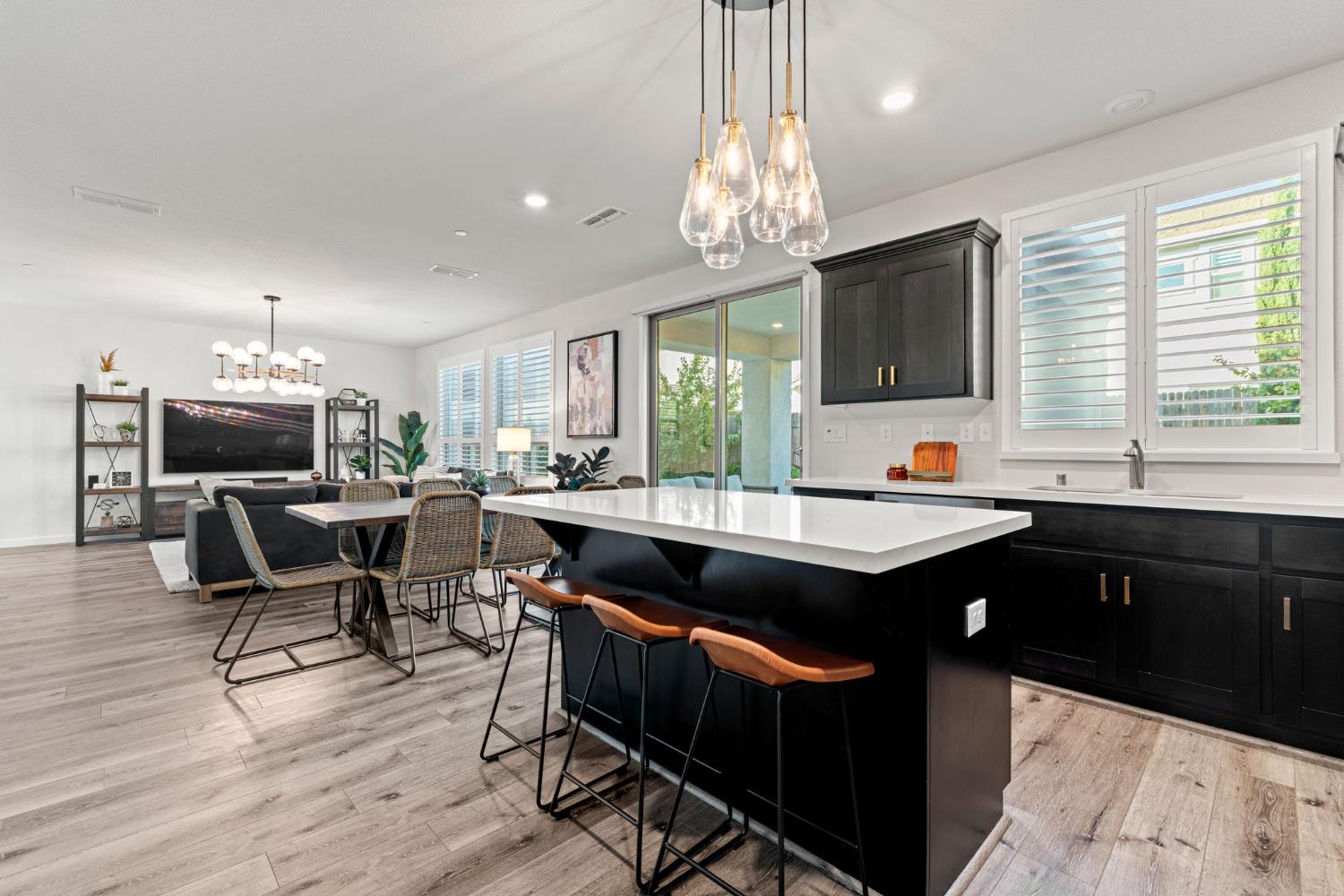3017 Checkerspot Street Roseville, CA 95747 - Photo 13 of 57 a kitchen with a counter space a sink appliances and a window