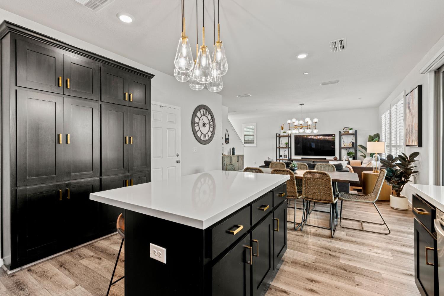3017 Checkerspot Street Roseville, CA 95747 - Photo 14 of 57 a living room with stainless steel appliances kitchen island a table chairs a sink and a refrigerator