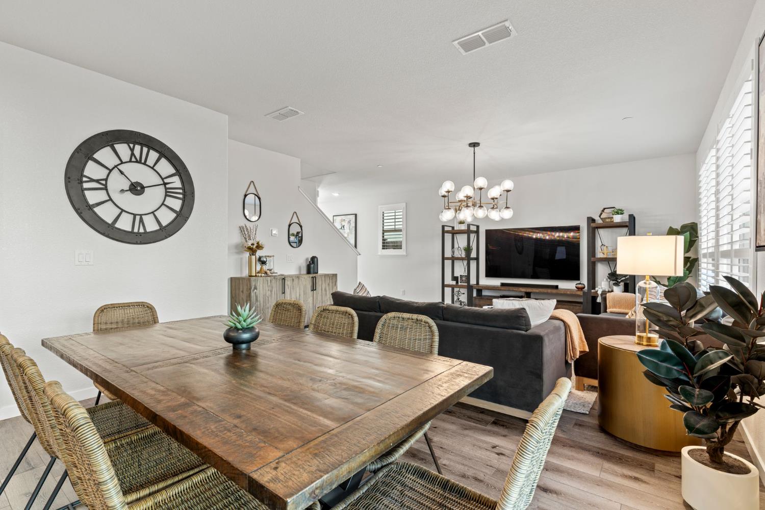 3017 Checkerspot Street Roseville, CA 95747 - Photo 25 of 57 a view of a dining room with furniture and wooden floor