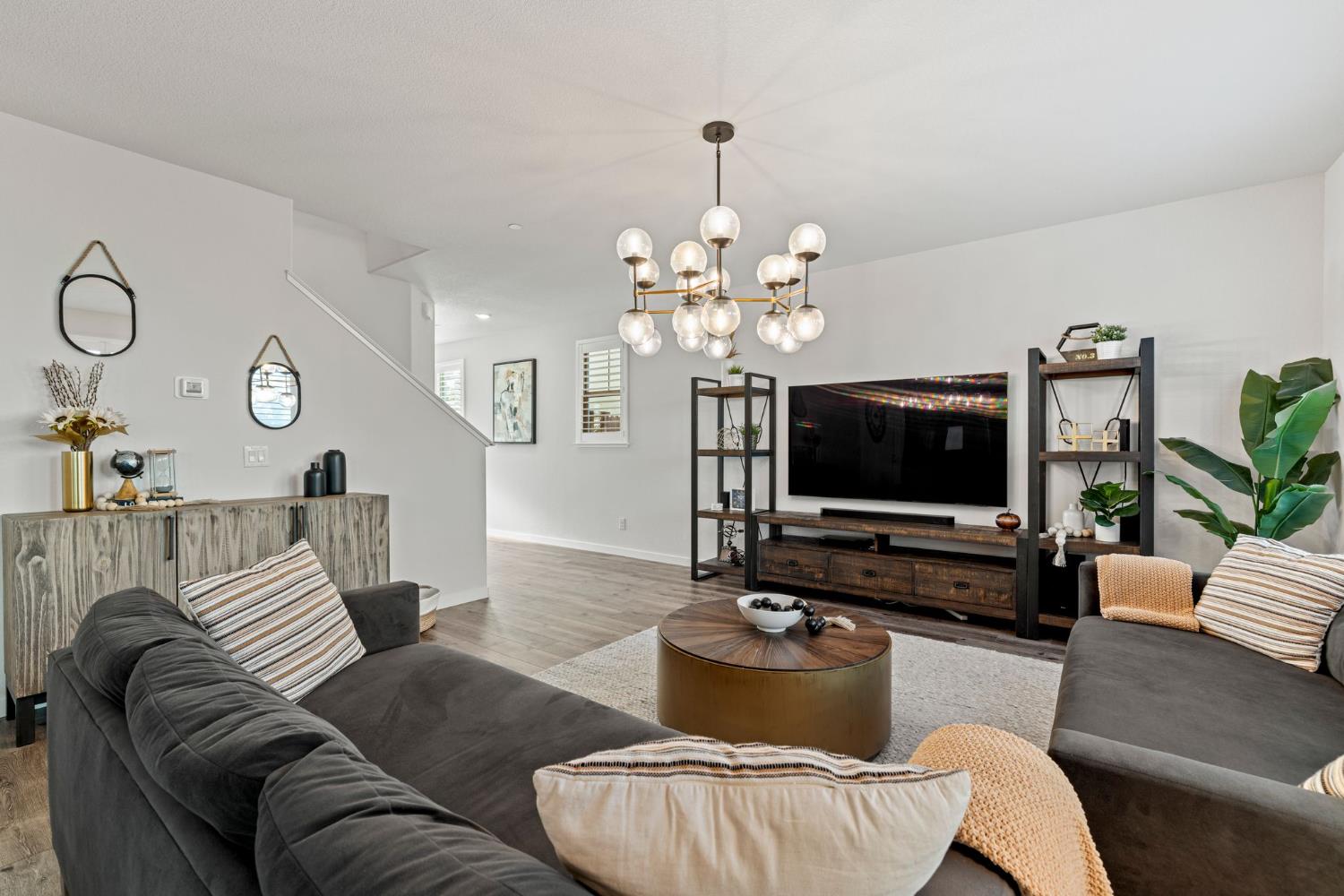 3017 Checkerspot Street Roseville, CA 95747 - Photo 26 of 57 a living room with furniture and a flat screen tv