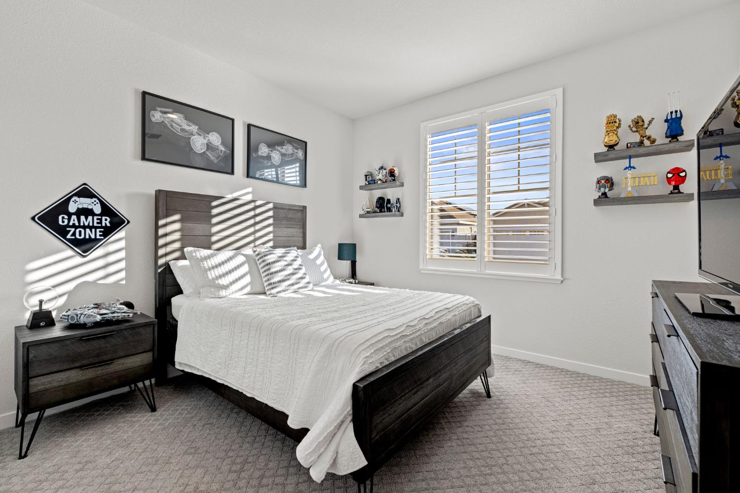 3017 Checkerspot Street Roseville, CA 95747 - Photo 28 of 57 a bedroom with a bed and a window