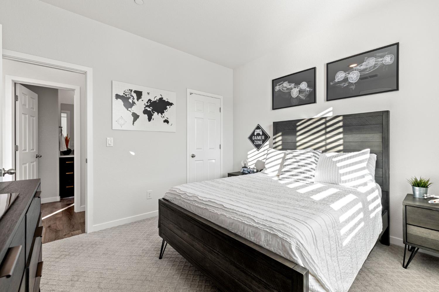 3017 Checkerspot Street Roseville, CA 95747 - Photo 29 of 57 a bedroom with a bed and a lamp