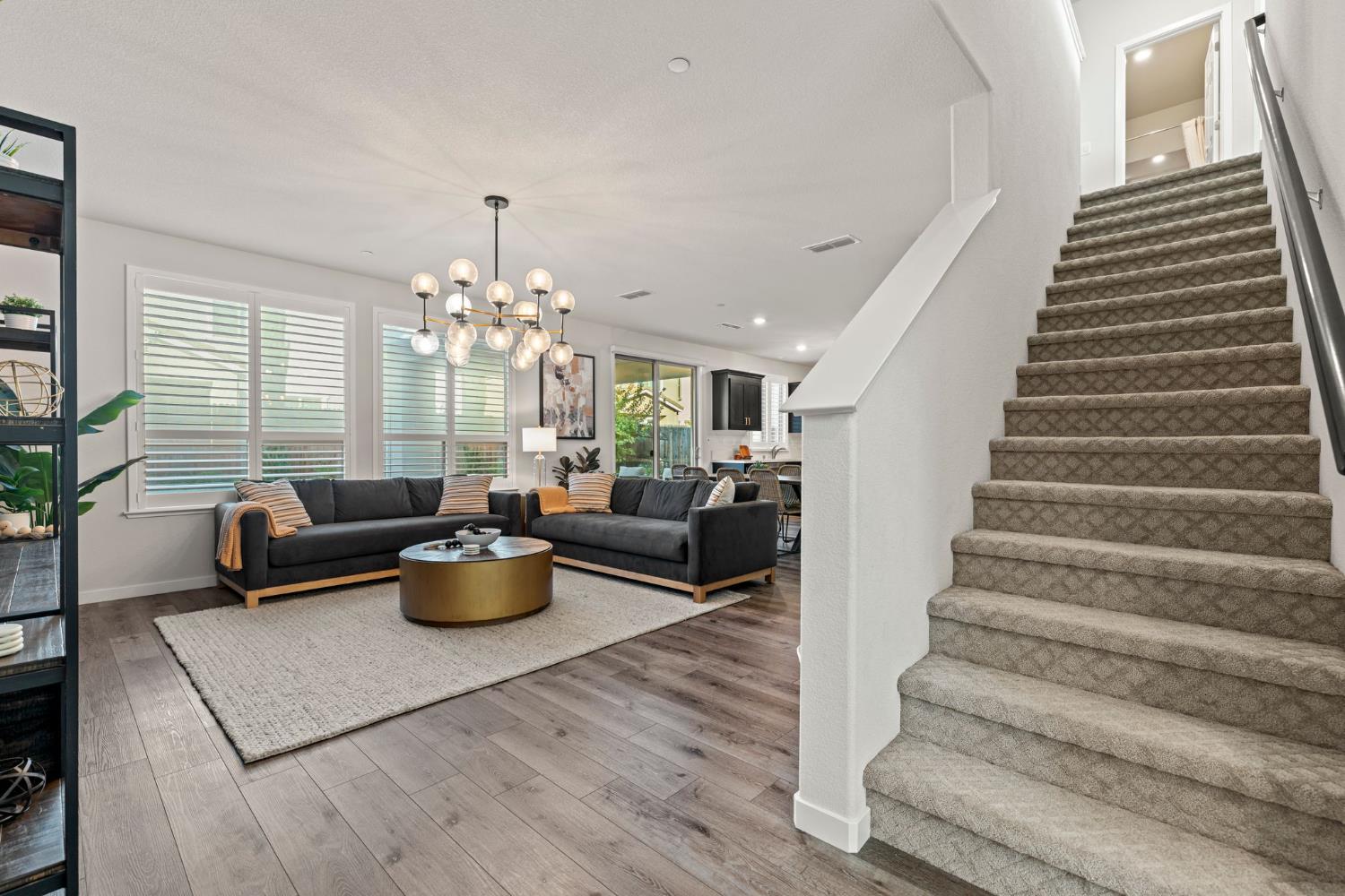 3017 Checkerspot Street Roseville, CA 95747 - Photo 31 of 57 a living room with furniture and wooden floor