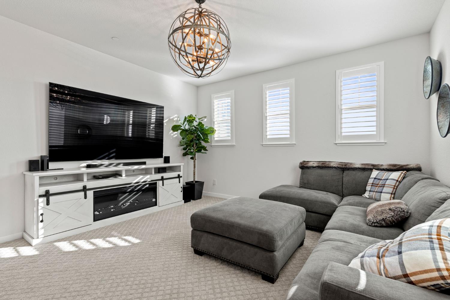 3017 Checkerspot Street Roseville, CA 95747 - Photo 35 of 57 a living room with furniture and a flat screen tv