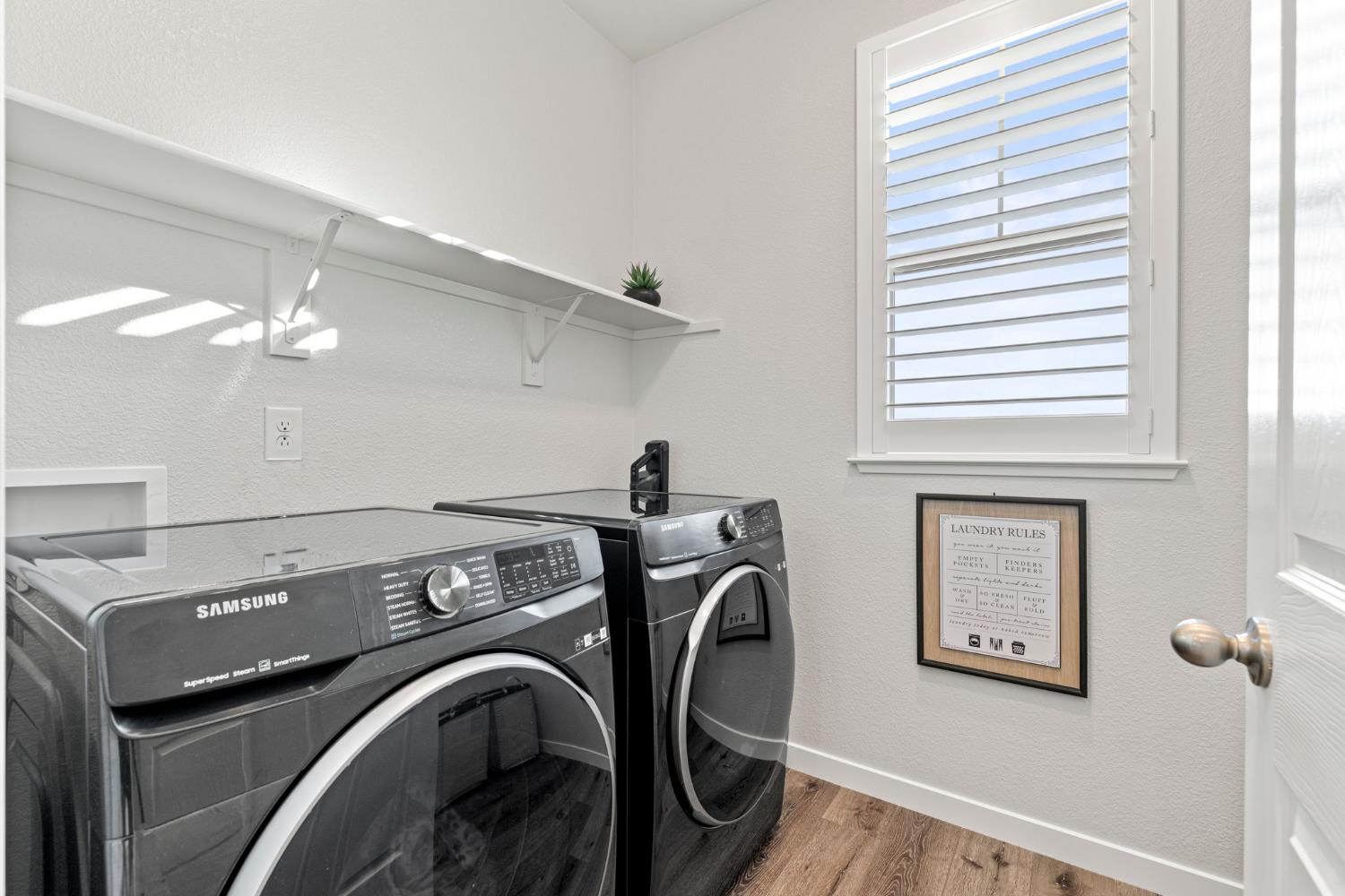 3017 Checkerspot Street Roseville, CA 95747 - Photo 37 of 57 a view of a livingroom with washer and dryer