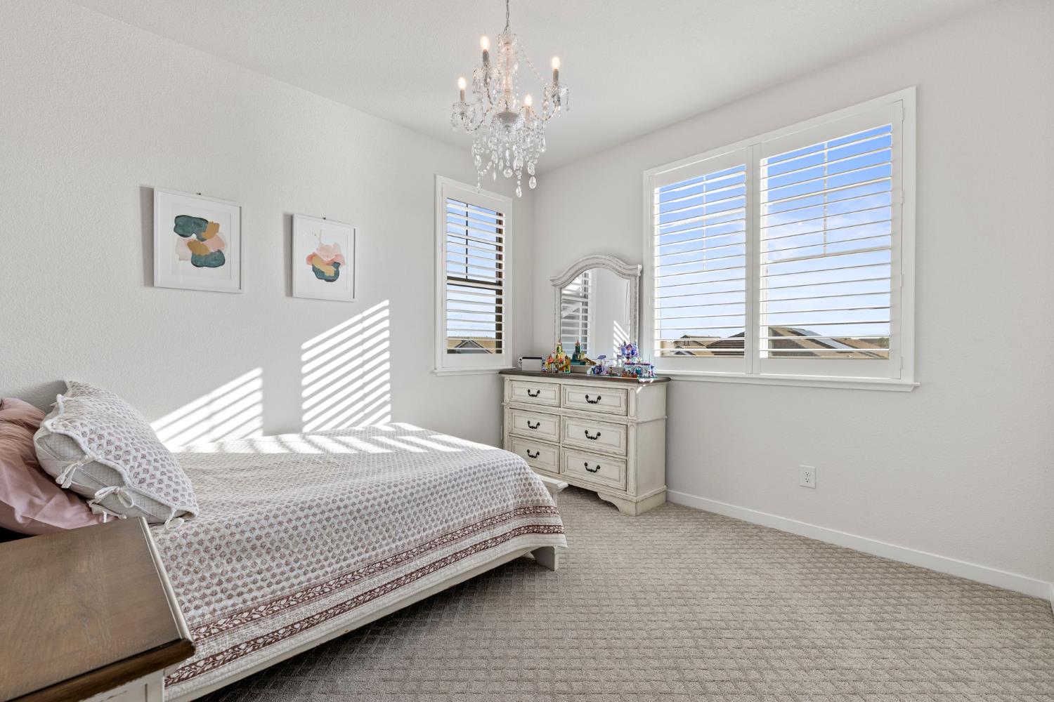 3017 Checkerspot Street Roseville, CA 95747 - Photo 38 of 57 a bedroom with a bed dresser and window