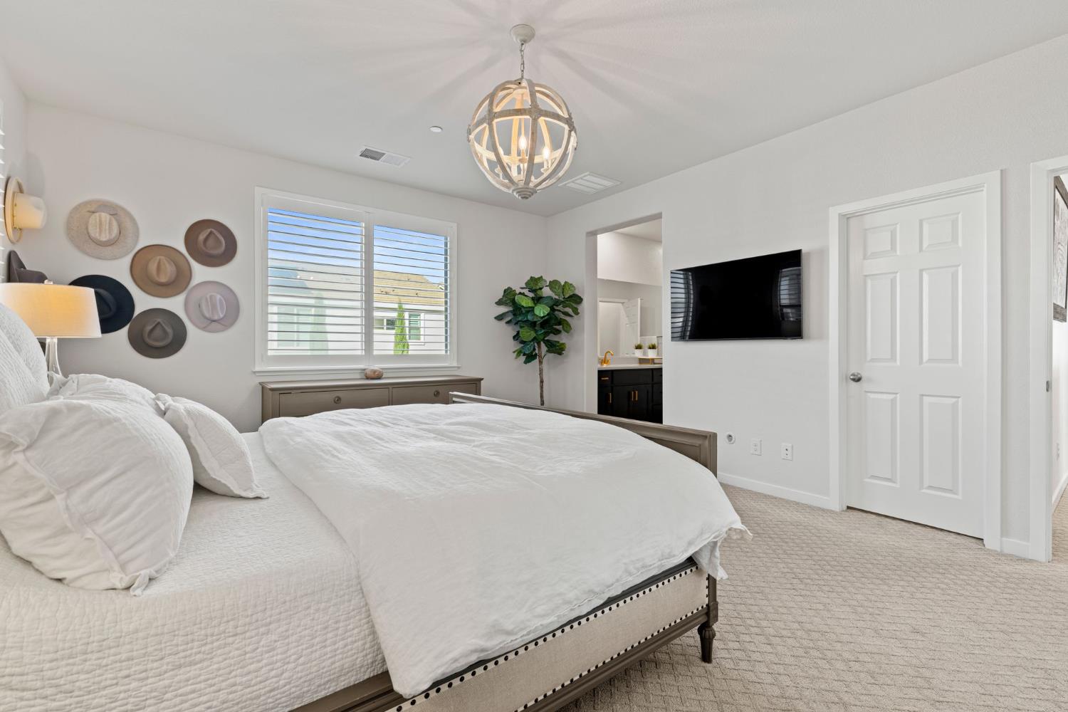 3017 Checkerspot Street Roseville, CA 95747 - Photo 45 of 57 a bedroom with a bed and a flat screen tv