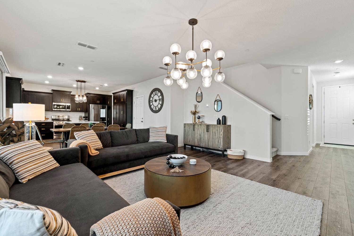 3017 Checkerspot Street Roseville, CA 95747 - Photo 7 of 57 a living room with furniture and a chandelier