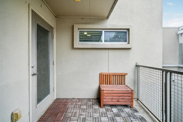 a view of room with stairs and furniture