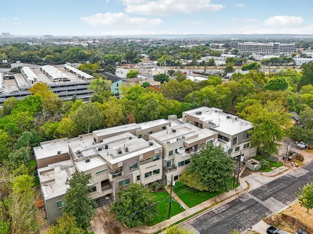 an aerial view of residential building with parking space