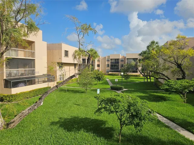 a view of a house with a big yard